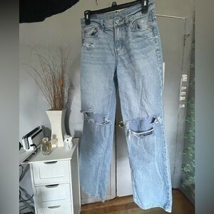 Light wash distressed relaxed fit jeans